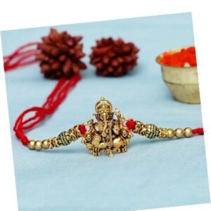 eCraftIndia Golden Religious Designer Ganesha Rakhi with Red Thread, and Roli Chawal Pack - Rakhi for Brother
Rajender 027